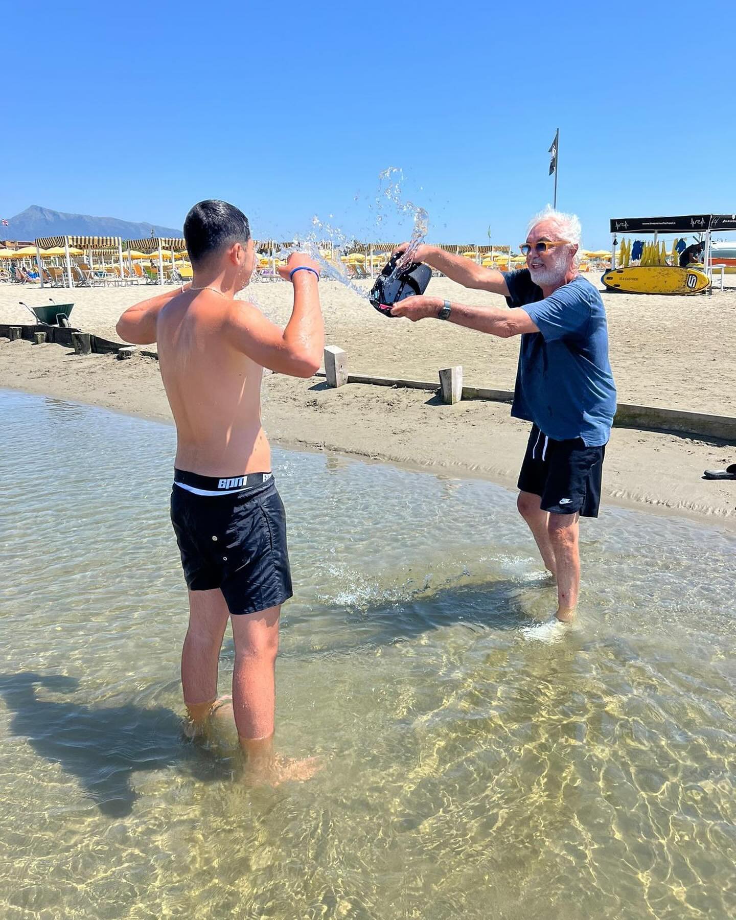 Flavio Briatore Sulla spiaggia di Marina di Pietrasanta con Falco...